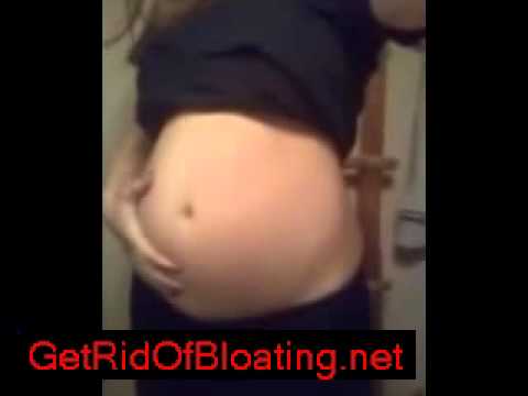 Asian girl chugging water bloat belly