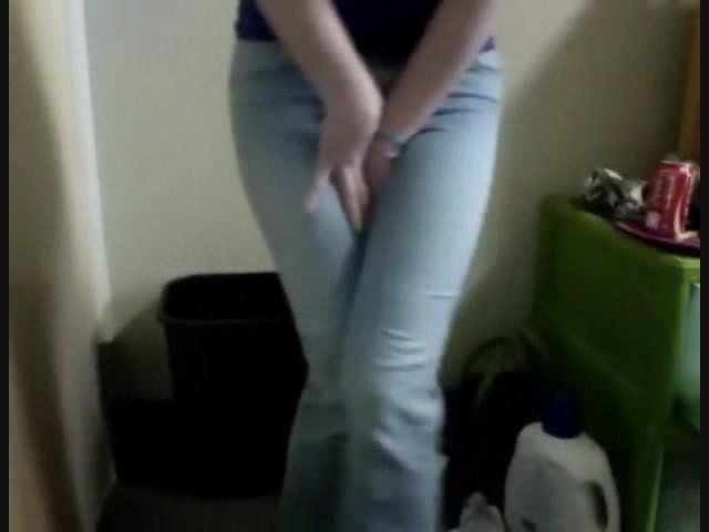 Girl wetting tight blue jeans