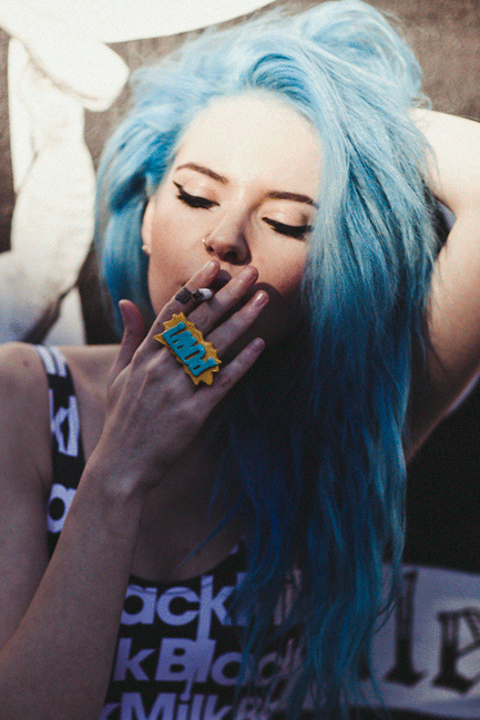 Beautiful girl smoking cigar fingering herself