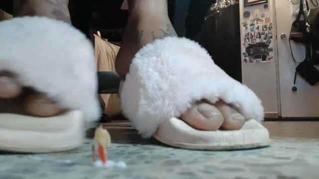 Girl play with pink fuzzy slippers
