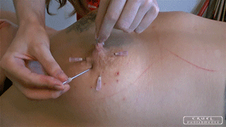 Slave gets nipples pierced with needle