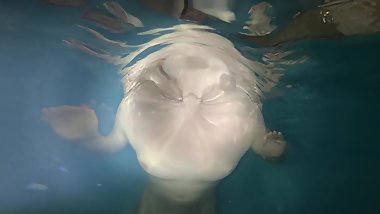 Underwater ginger teasing with beautiful curves